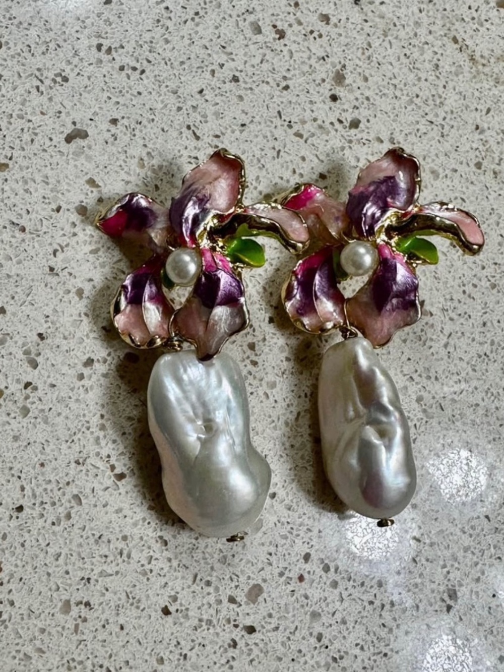 Mother of Pearl Earrings embellished with pink and purple flowers